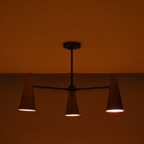 Close-up of handcrafted copper cone shade showing smooth finish and warm interior glow