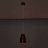 Hudson Hammered Copper Bell Pendant Light illuminated with warm downward lighting for ambient interiors.