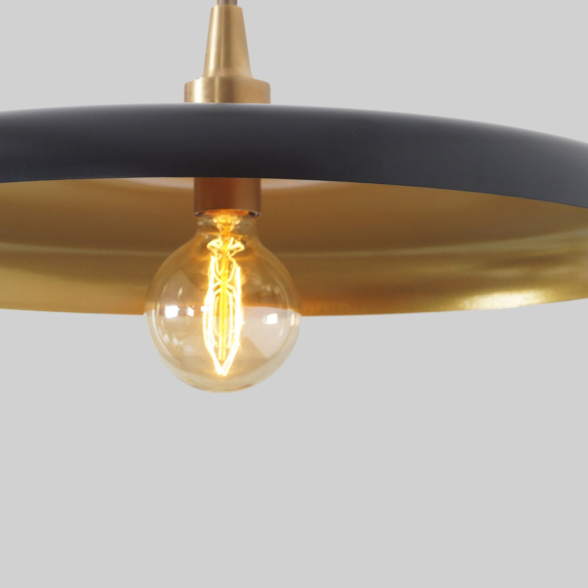 Matte black and brushed brass ceiling pendant lamp with minimalist industrial style