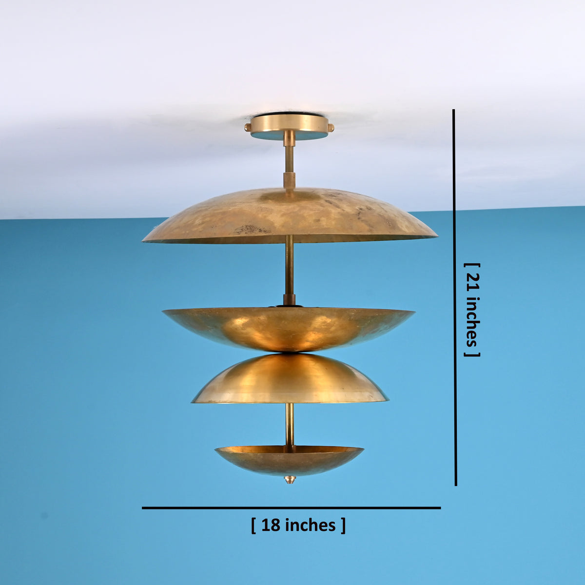 Brass chandelier with layered bowl shades showing dimensions of 18 inches width and 21 inches height.