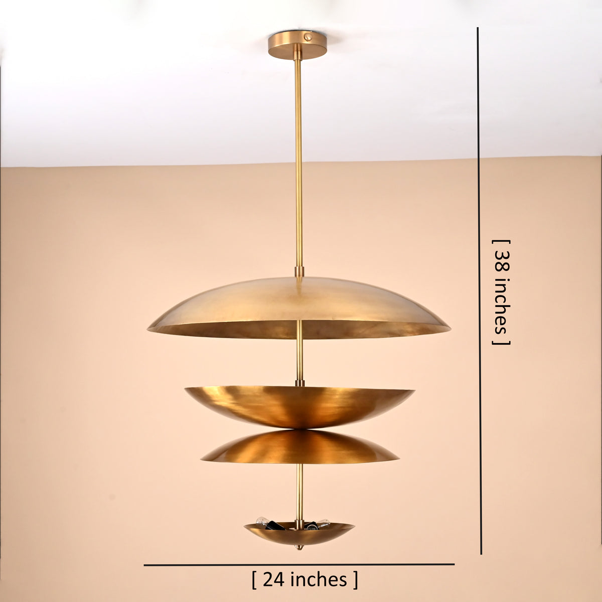 Layered brass disc chandelier showing 24-inch width and 38-inch height with sculptural stacked shade design.