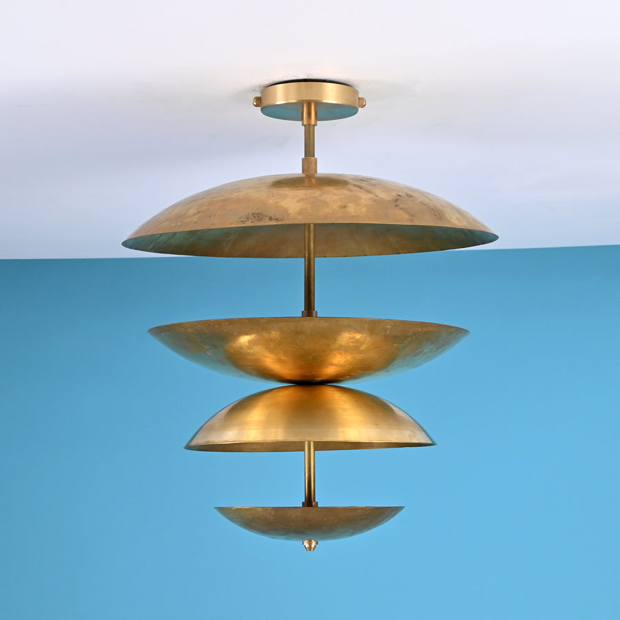 Layered brass disc flush mount ceiling light with sculpted bowl shades, handcrafted in solid brass with warm indirect ambient lighting.