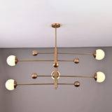 Top-angle view of linear 5-light brass chandelier featuring spherical opal globes arranged on geometric brass rods.