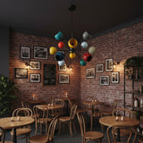 Tallinn 12 light multicolor Sputnik chandelier shown hanging from its black ceiling canopy and fixed stem.