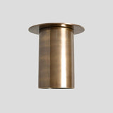 Front view of handcrafted long brass cylinder ceiling light with modern industrial style