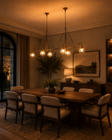 Long dining room chandelier with ribbed glass globe shades and brass frame for statement lighting over tables