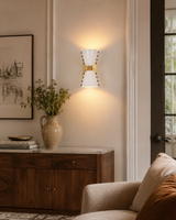 Luma Diabolo 2-light wall sconce shown in a styled living room with warm up and down wall glow