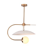 Luna Arc globe pendant light shown illuminated with warm ambient glow and sculptural curved arm design