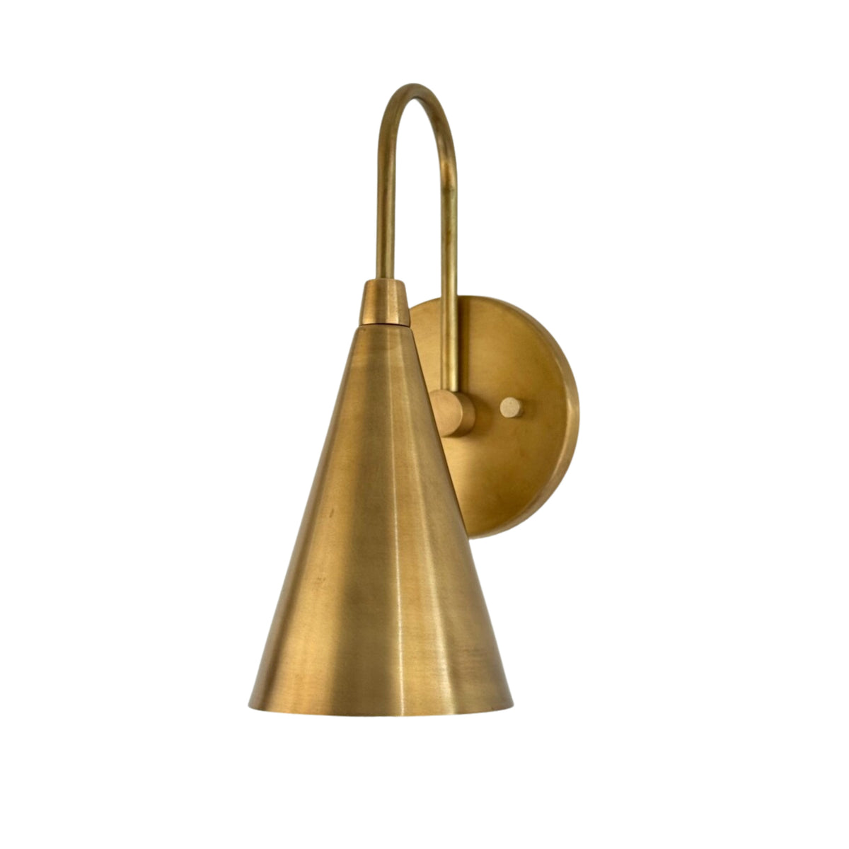 Angled view of the Luna Tapered Cone Wall Sconce Model 32705 in handcrafted solid brass with a minimalist cone shade.