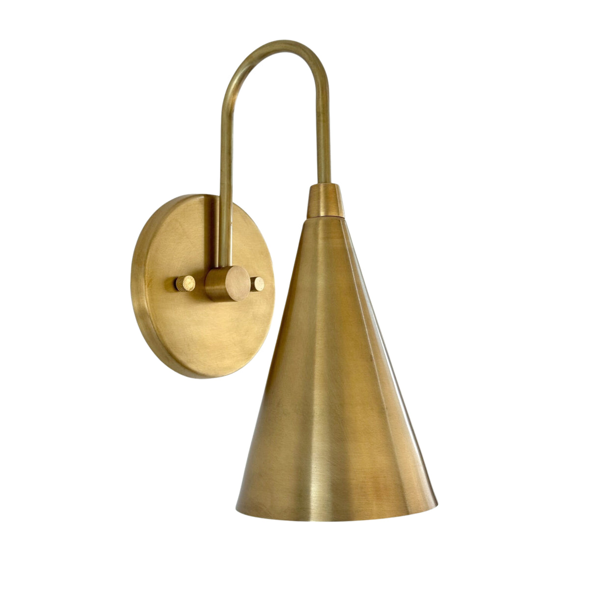 Front view of the Luna Tapered Cone Wall Sconce Model 32705 featuring a handcrafted tapered cone shade and curved brass arm.