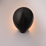 Luxury halo wall light creating soft warm wall wash for lounges, cafés, boutique hotels, and interiors
