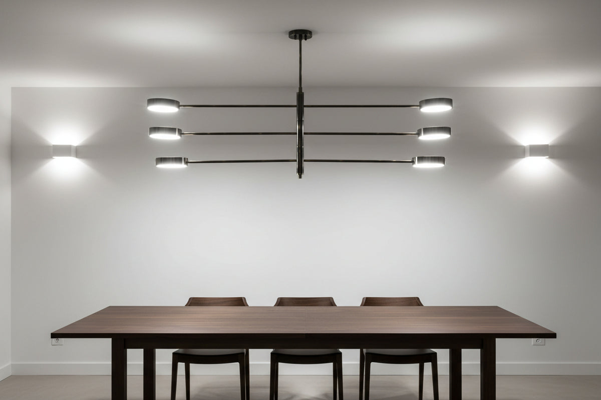 Madrid linear LED ceiling fixture featuring a solid brass frame, long horizontal arms, and modern round light heads
