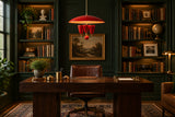 Statement ceiling light with red enamel dome, brass details and three curved arms for dining or living interiors