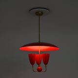 Three light red dome chandelier in full brass construction with enamel painted shades and decorative center ball