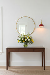Mallorca single-light bedroom wall sconce with red bowl-shaped shade and elegant brass wall-mounted design