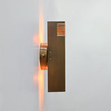 Marbella brass wall sconce front view featuring a clean rectangular body, round backplate, and brass patina finish