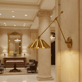Marlow Pleated Brass Swing Arm Wall Sconce with adjustable arm and pleated metal shade, angled view, Model 32817