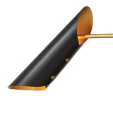 Matte black brass cone light shade with gold interior finish creating warm ambient lighting