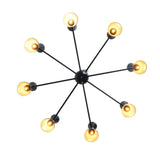 Top view of 8-arm brass chandelier showing circular light arrangement and geometric black double cone shades