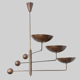 Vintage-inspired brass chandelier with blackened bronze finish and minimalist mid-century structure