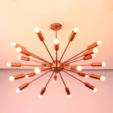 Ceiling view of mid century modern brass sputnik chandelier with evenly spaced illuminated arms.