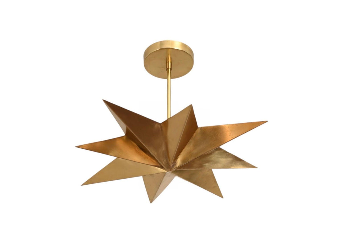 Mid century modern brass star pendant light with sculptural multi point design and flush ceiling canopy