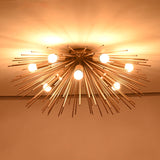 Mid century brass starburst chandelier fully illuminated with dramatic sculptural radiance
