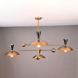 Side angle of mid-century modern Diabolo brass chandelier featuring eight bowl-shaped brass shades and black cone sockets.
