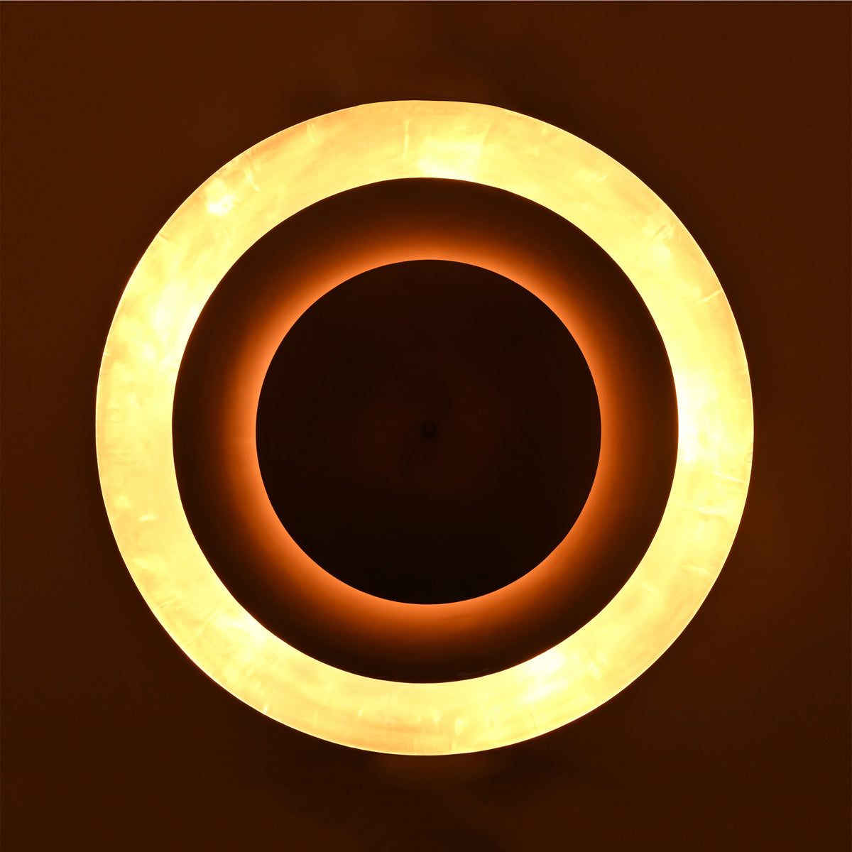 Mid century disc pendant light with sculptural layered form, soft diffuser, and warm lighting for refined interiors