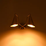 Mid century double cone wall sconce with brass finish and downward light effect for stylish interior wall lighting