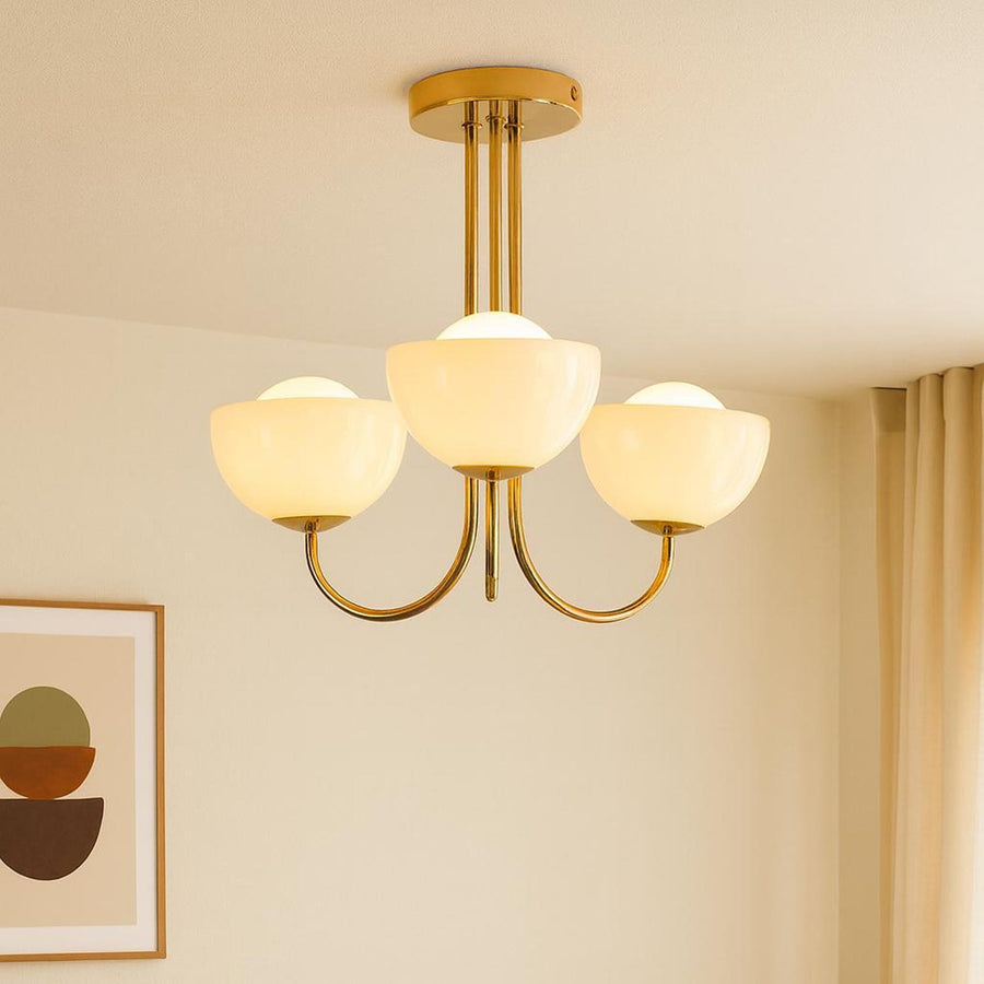 Mid-century modern 3-light bowl glass chandelier in solid brass providing warm ambient ceiling lighting