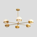 Mid-century modern brass chandelier with six white glass globes, handcrafted minimalist ceiling light.