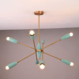 Mid-century modern Sputnik chandelier with teal light shades, brass arms, and warm bulbs illuminated against a neutral ceiling background