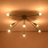 Mid-century orbit chandelier illuminated at night highlighting balanced radial design