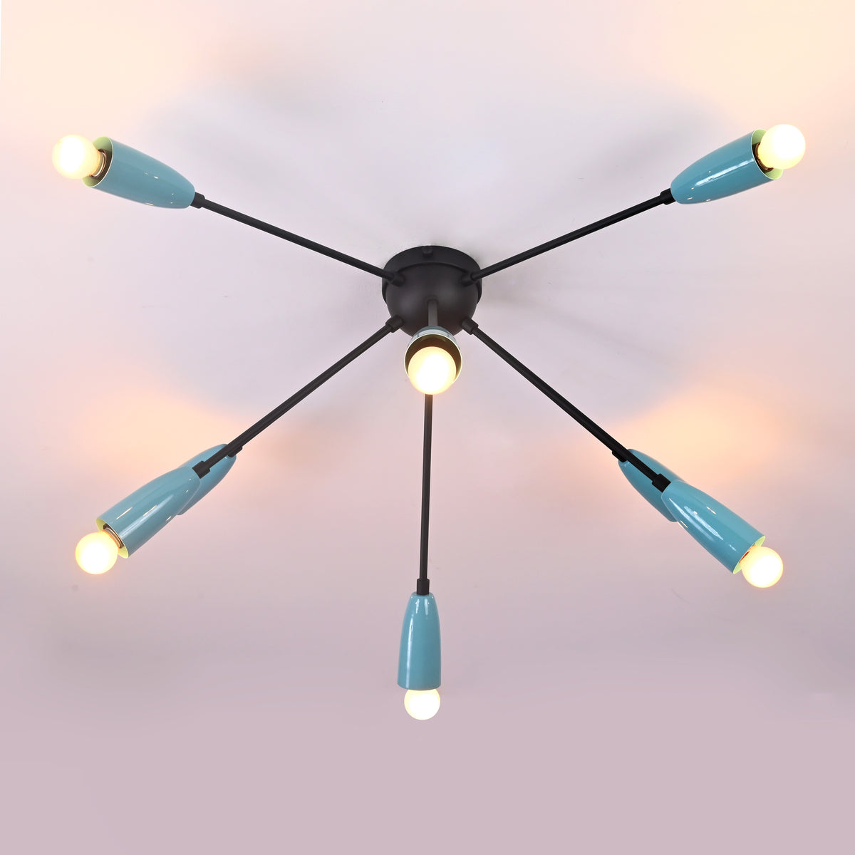 Symmetrical view of mid-century modern orbit chandelier with cone-shaped metal shades