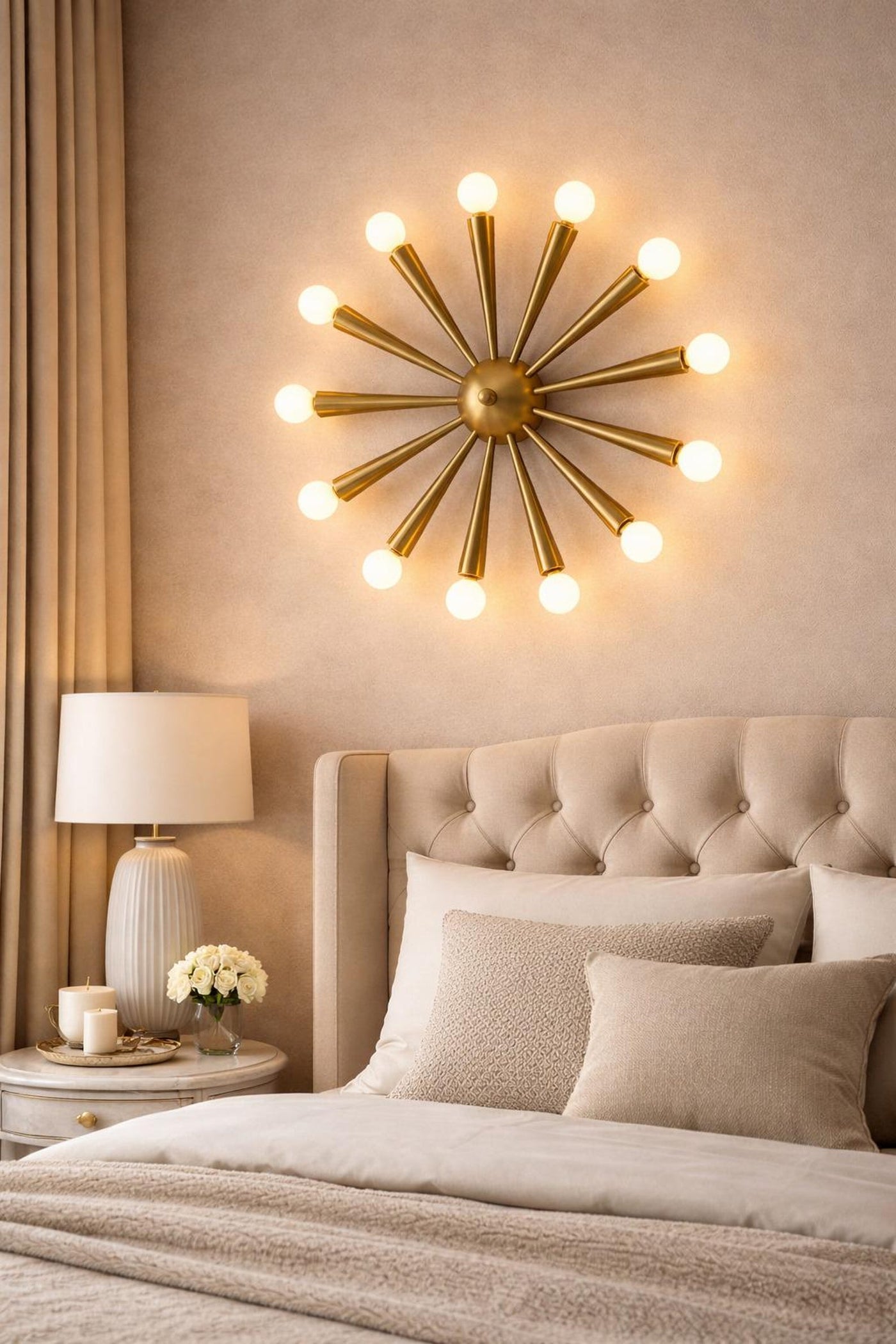 Mid-century starburst brass wall light installed above a bed, creating warm ambient lighting with a sculptural 12-light brass design.