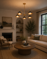 Milan 5-light black and brass curved arm chandelier displayed in a warm modern living room interior