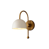 Milan dome wall sconce with curved brass arm and round wall canopy – angled view – Model 32775