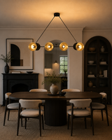 Milan Double Cone 8 light linear chandelier installed above a dining table in a modern dining room