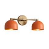Milan Double Dome Wall Sconce with orange shades shown from angled view, Model 32816