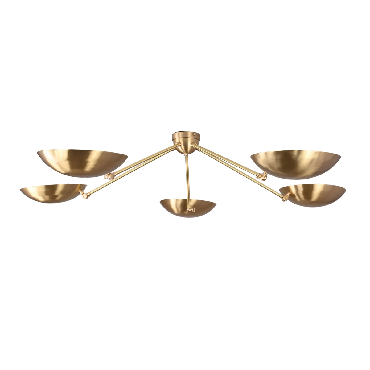 Minimalist brass ceiling chandelier with bowl shades creating soft indirect uplighting.