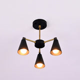 Front view of minimalist cone style brass chandelier with three lights and matte black accents