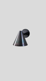 Minimalist cone-shaped wall light in blackened brass finish, ideal for modern bedrooms, cafes, and hallway lighting.