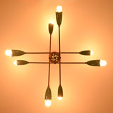 Underside detail of mint green brass sputnik chandelier showcasing handcrafted structure and warm light.