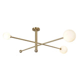 Modern 3-light brushed brass globe ceiling light with opal glass shades by Brass Leaf Studio.
