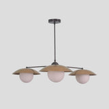 Handmade brass chandelier featuring three globe diffusers with dome brass shades, perfect for contemporary dining rooms and interiors.