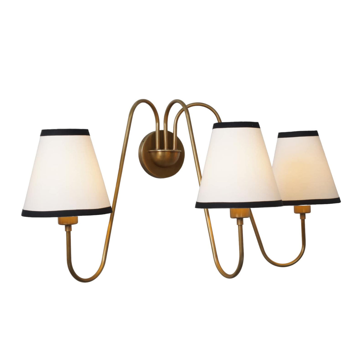 Modern 3-light brass wall sconce with elegant curves and white shades viewed from the side