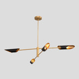 Adjustable modern brass chandelier featuring black bowl shades with golden interiors, designed for warm ambient lighting.