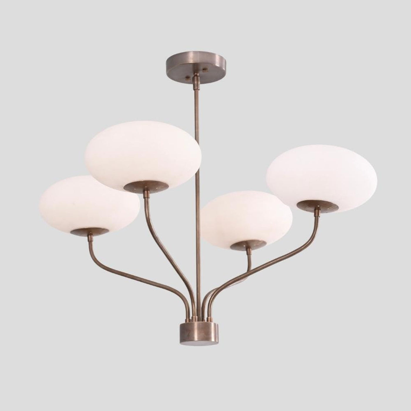 Modern brass chandelier with four bowl-shaped frosted glass shades, handmade ceiling light by Brass Leaf Studio.