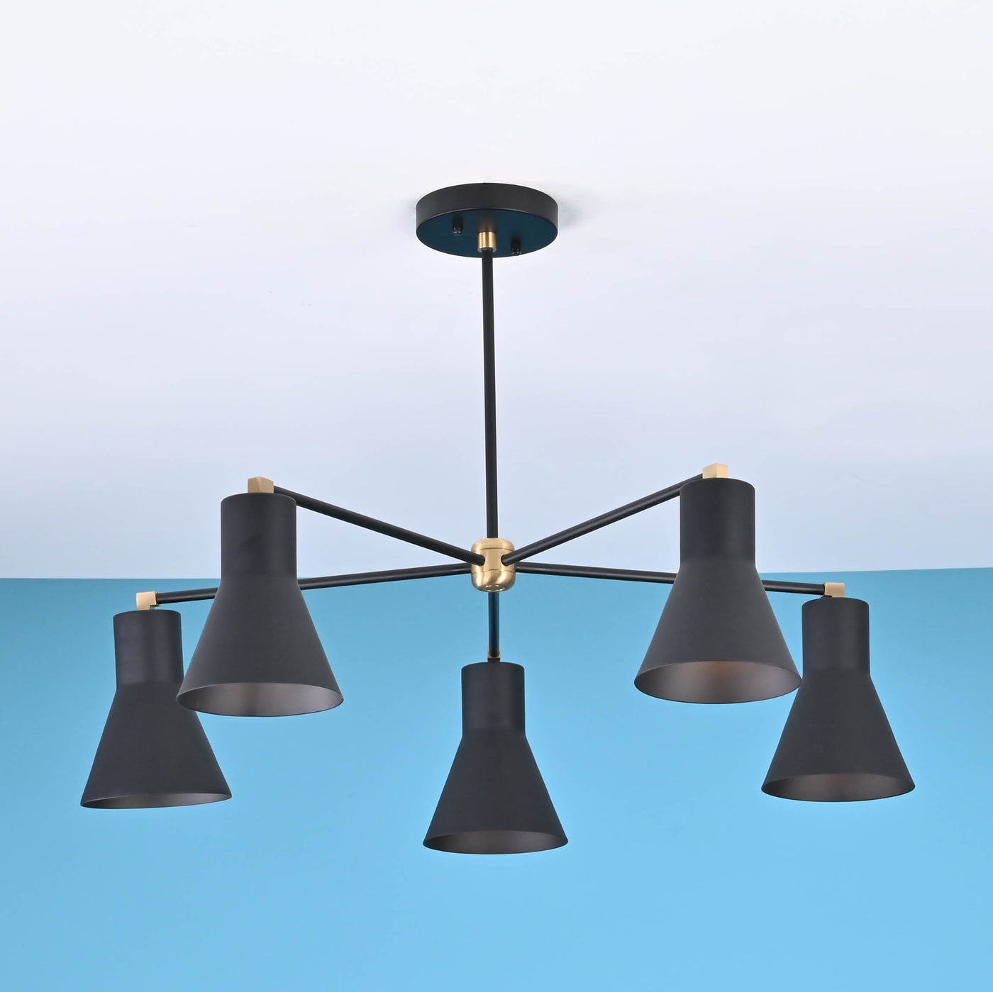 Modern 5 cone brass chandelier with black metal arms and minimalist industrial ceiling design